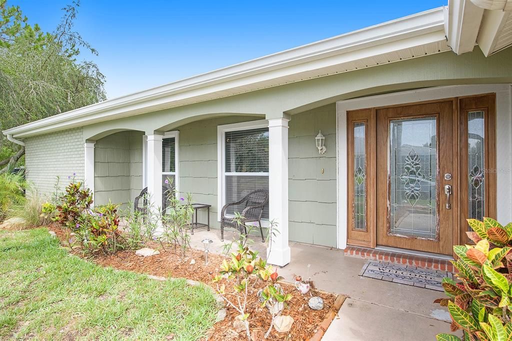 Welcoming front porch with seating space