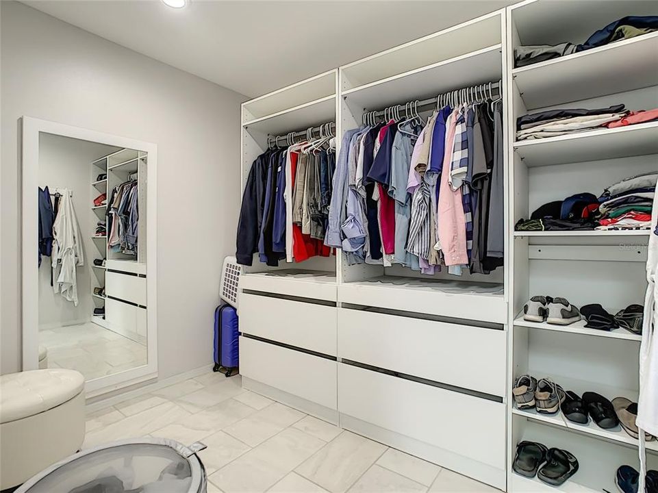 His closet which is even large than it appears.