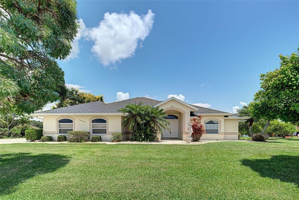 Stunning Home with side entrance garage on double lot.