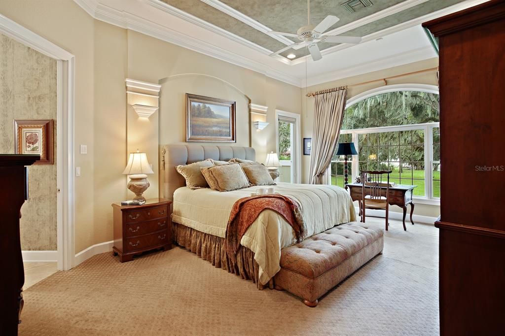 Carpeted master suite with lanai access and private courtyard.
