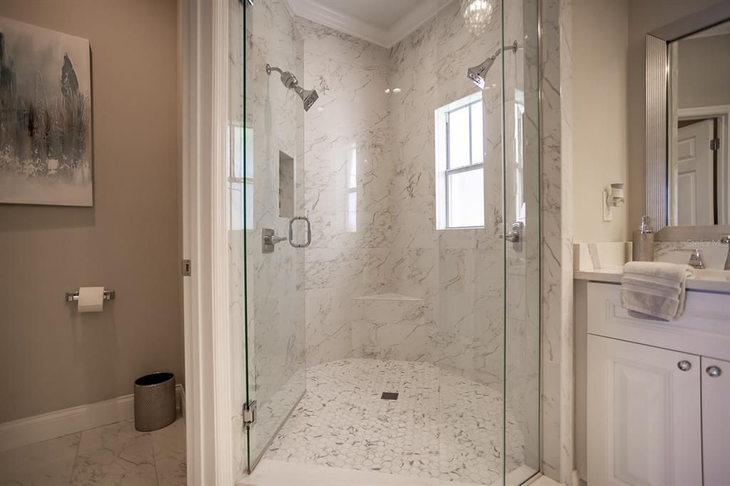 Walk-in shower with dual shower heads