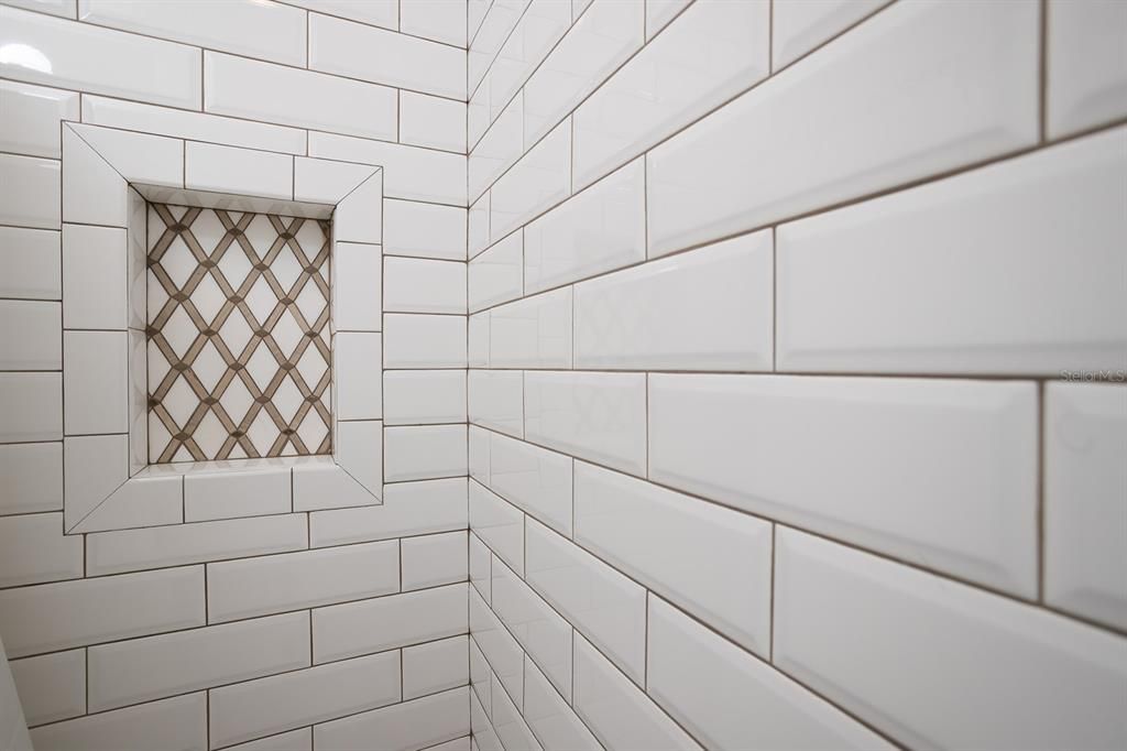 Custom tile niche in guest bath