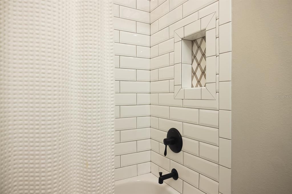 Beautiful tile shower in guest bath
