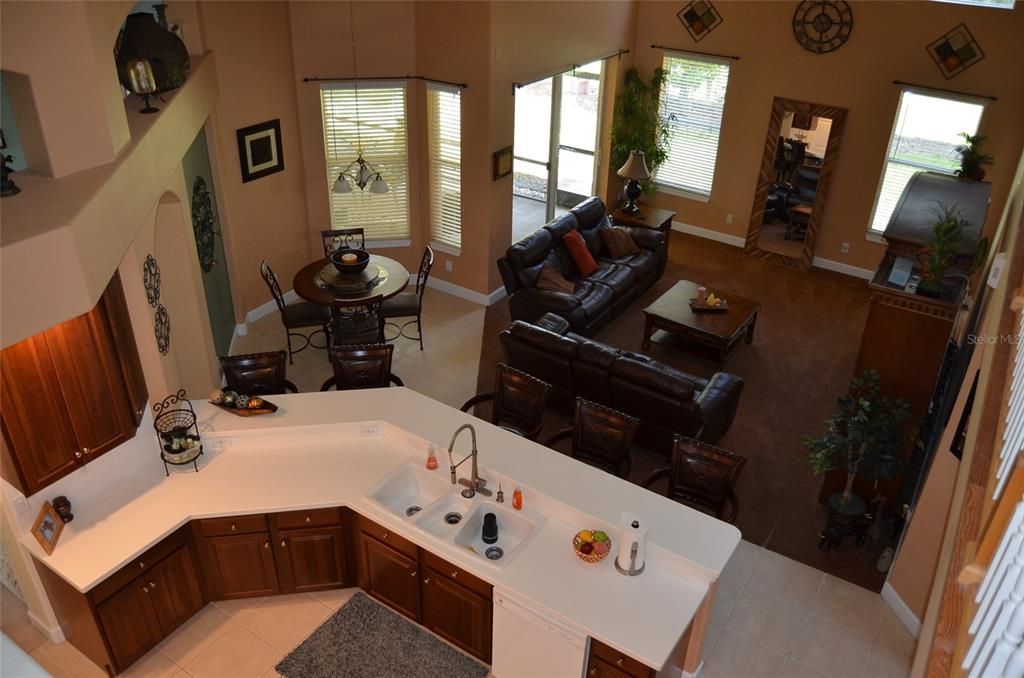 View from cat walk looking down at kitchen / family room.