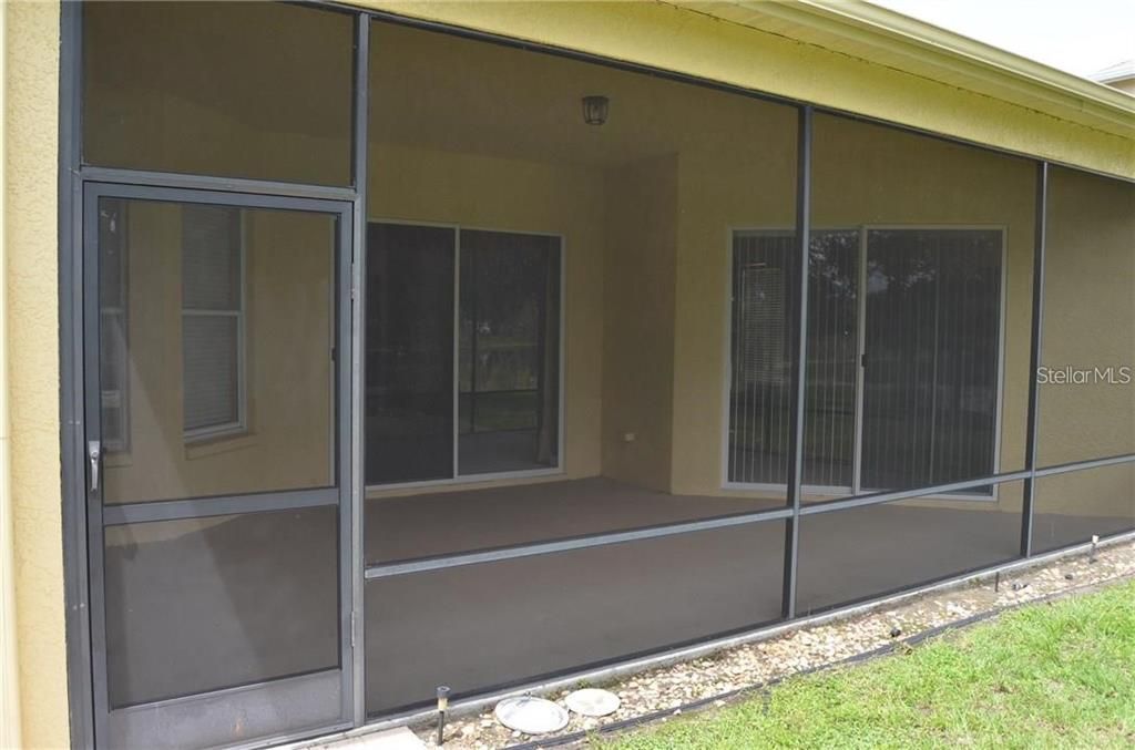 Huge covered and screened patio overlooking the lake.