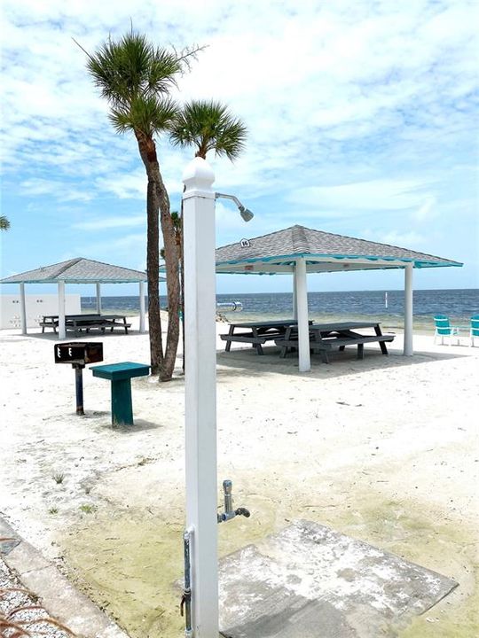 Optional membership to the Private Gulf Harbors Beach Club.  Covered pavilions, BBQ grills, restrooms, adirondack chairs on the beach, showers.  Membership currently $156/year.