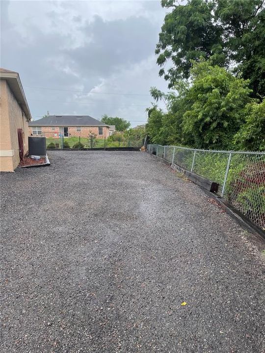 gravel parking area by the garage