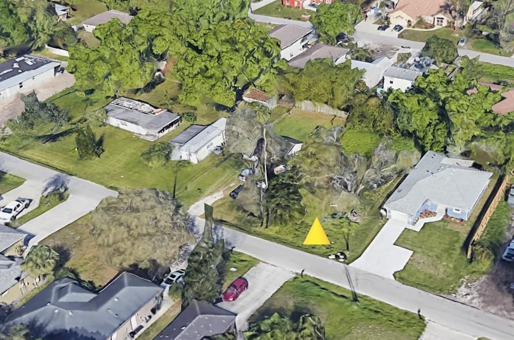 aerial showing neighbor to left (orignal cracker style home) and neighbor to right in newer home. homes across the street are also newer.