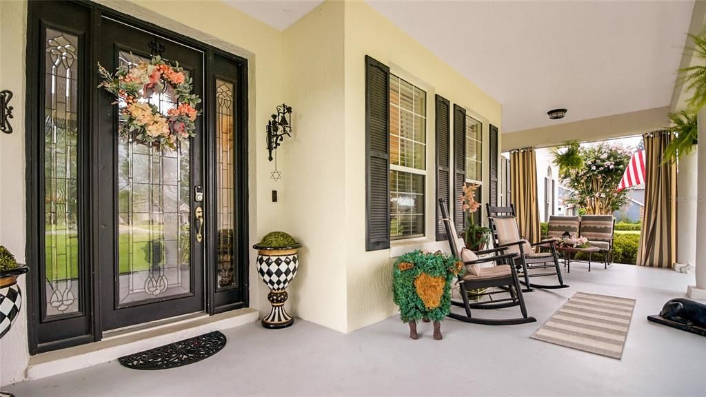 What a welcoming front porch!  Sit and chat with friends and family as you enjoy the afternoon breeze!