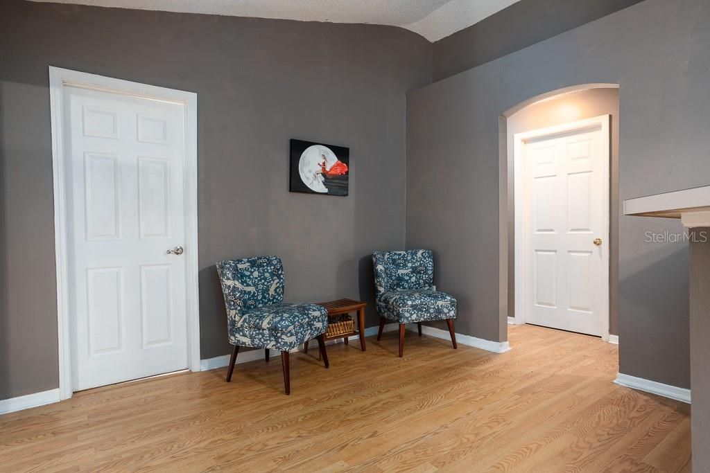 Rear living area. Bonus room door at left. Bedrooms at right.