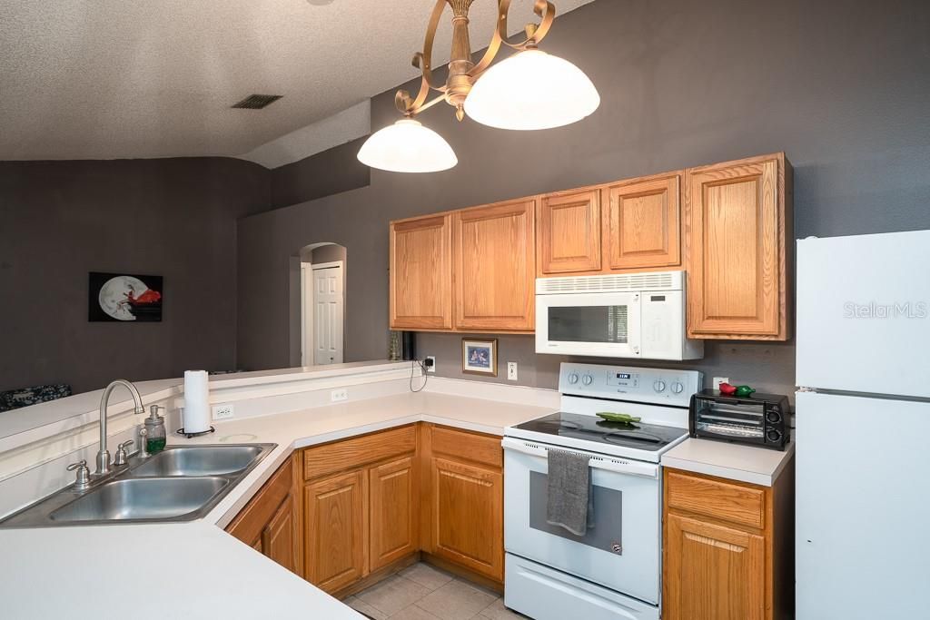 Kitchen includes all appliances and is open to dining area.