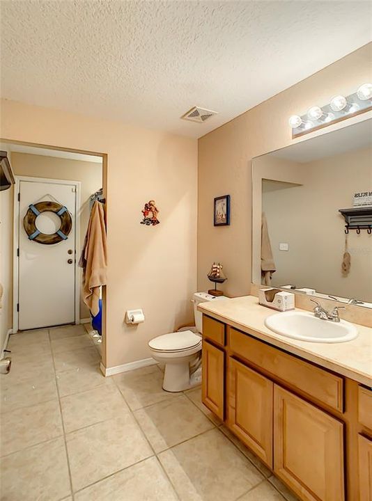 VIEW OF GUEST BATHROOM OFF FAMILY ROOM