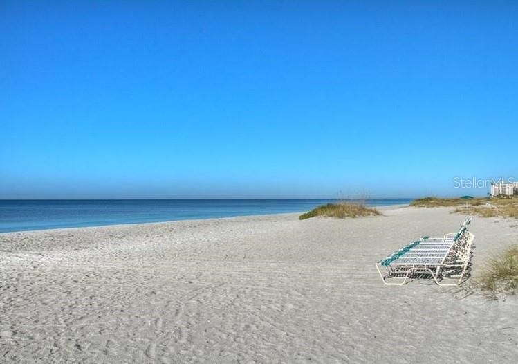 Sandy beach just steps away from the condo