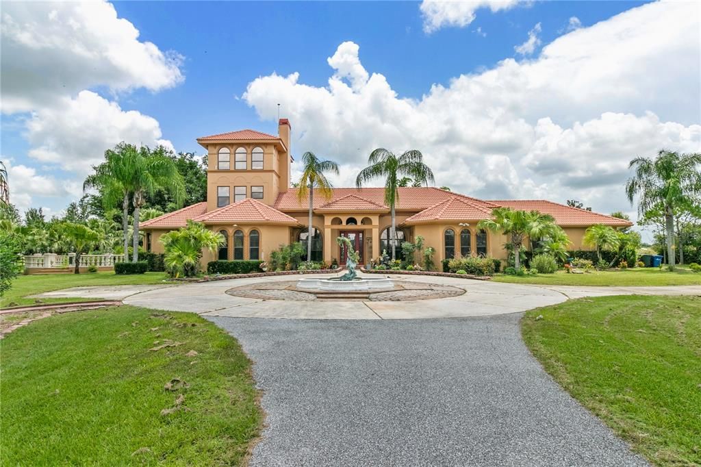 Front view, rose garden to the left, guest house and rv garage to the right