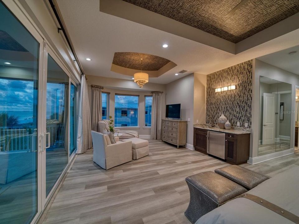 Master suite has morning bar with Subzero refrigeration, granite counter and exotic solid wood cabinetry.