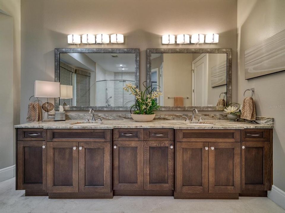 Master bath has dual vanities and fine finishes.