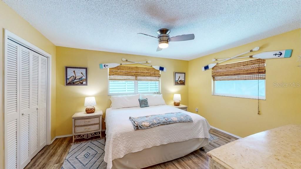 Pelican: Spacious bedroom witha ceiling fan, blinds and lots of light.