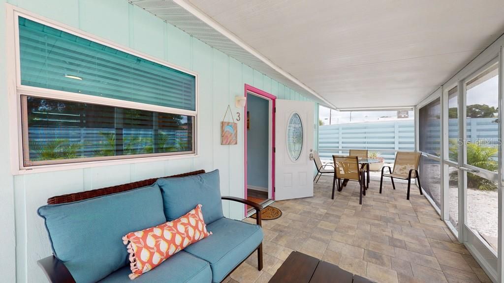 Dolphin: Spacious screened lanai with pavers. Enjoy the outdoor living area for eating or relaxing.