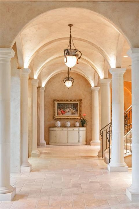 Upon entering, you're met with a stunning gallery dotted with stone columnsbeneath beautifully crafted groin vault ceilings.