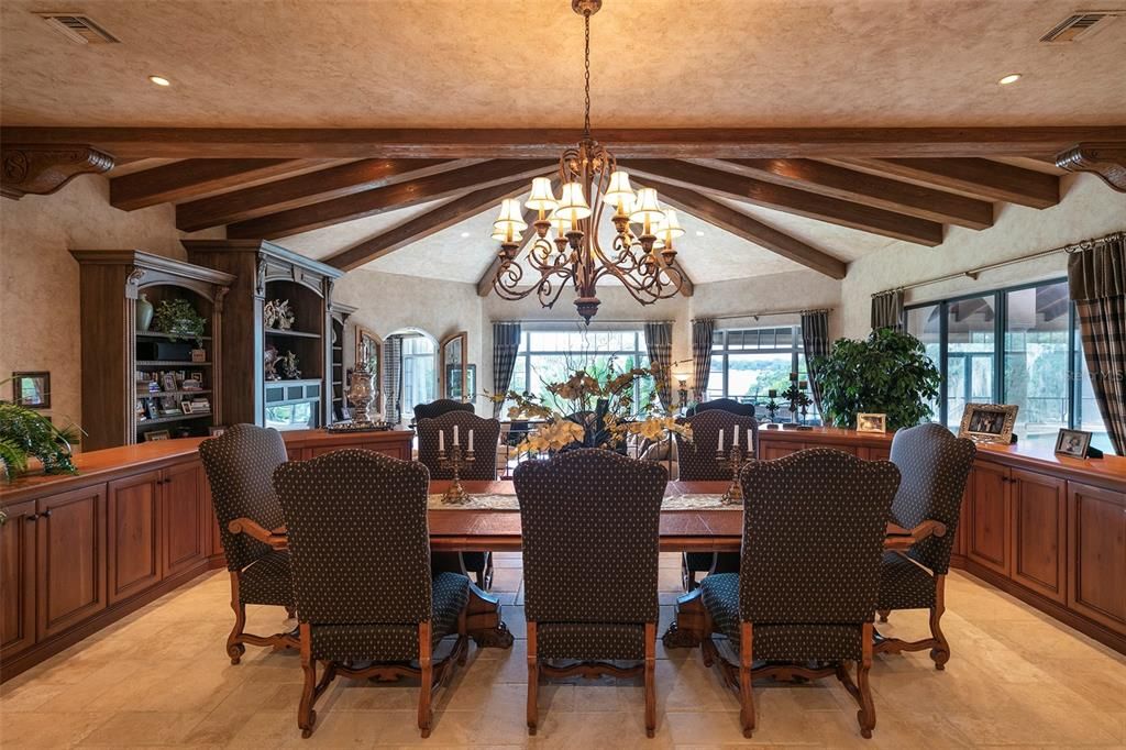 The formal dining area is bordered by custom cabinets for added storage.
