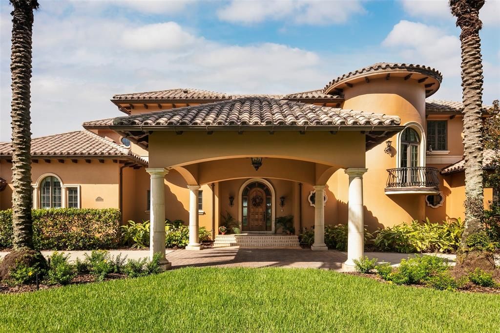 Beyond the circular motor court with porte cochere, anarched and beveled solid oak entry door reveals a stunninginterior spanning more than 11,000 square feet.