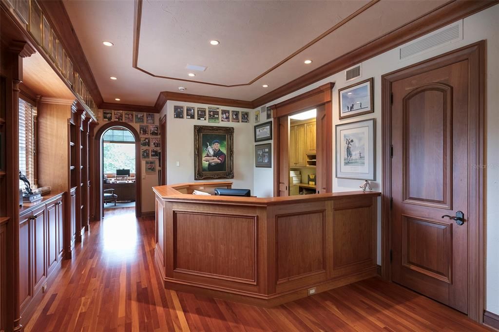 The designated reception area for the home office features two storage closets and powder bath.