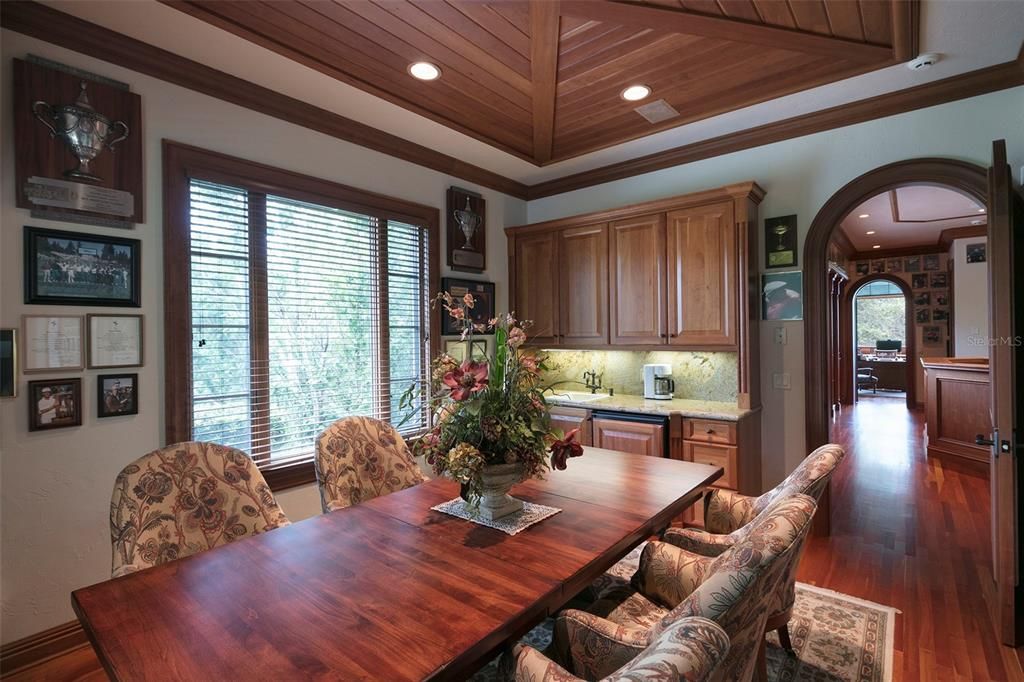 The conference room features wet bar with beverage fridge.