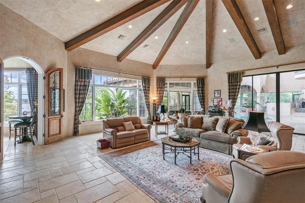 Large, glass sliding doors expand this great room outward to the screened lanai for indoor-outdoor living.