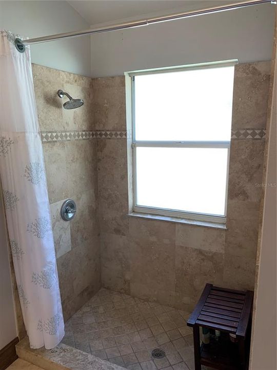 Master bathroom shower with cultured marble walls