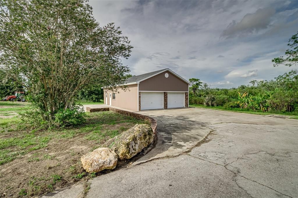 225 Golf Aire Blvd Detached Garage with RV Parking Pad and Inside Storage and Workshop.