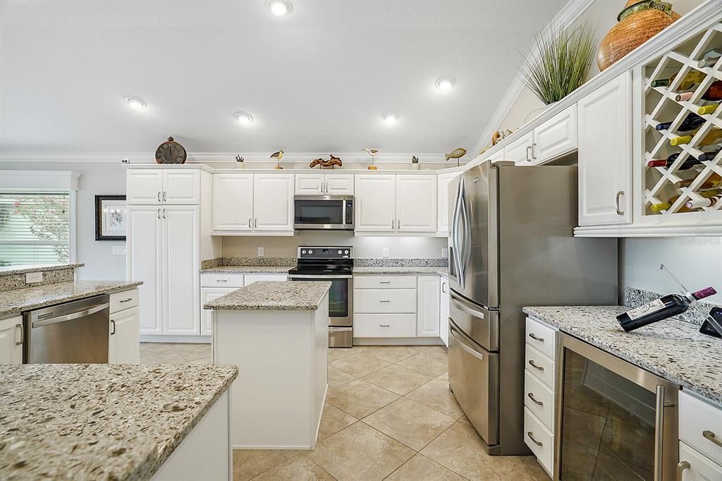 Updated kitchen with quartz countertops and stainless steel appliances