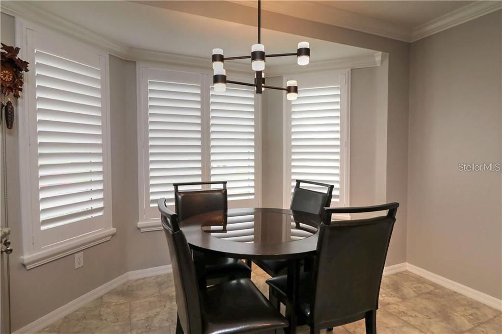Eat in area of kitchen with view of 5th green of Hacienda Oaks country club