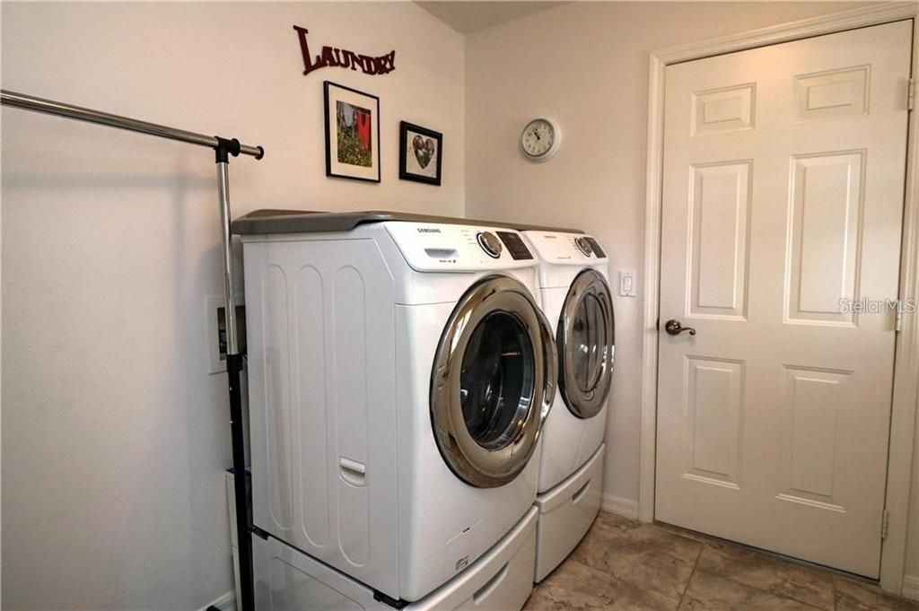 Inside laundry room with extra cabinet space