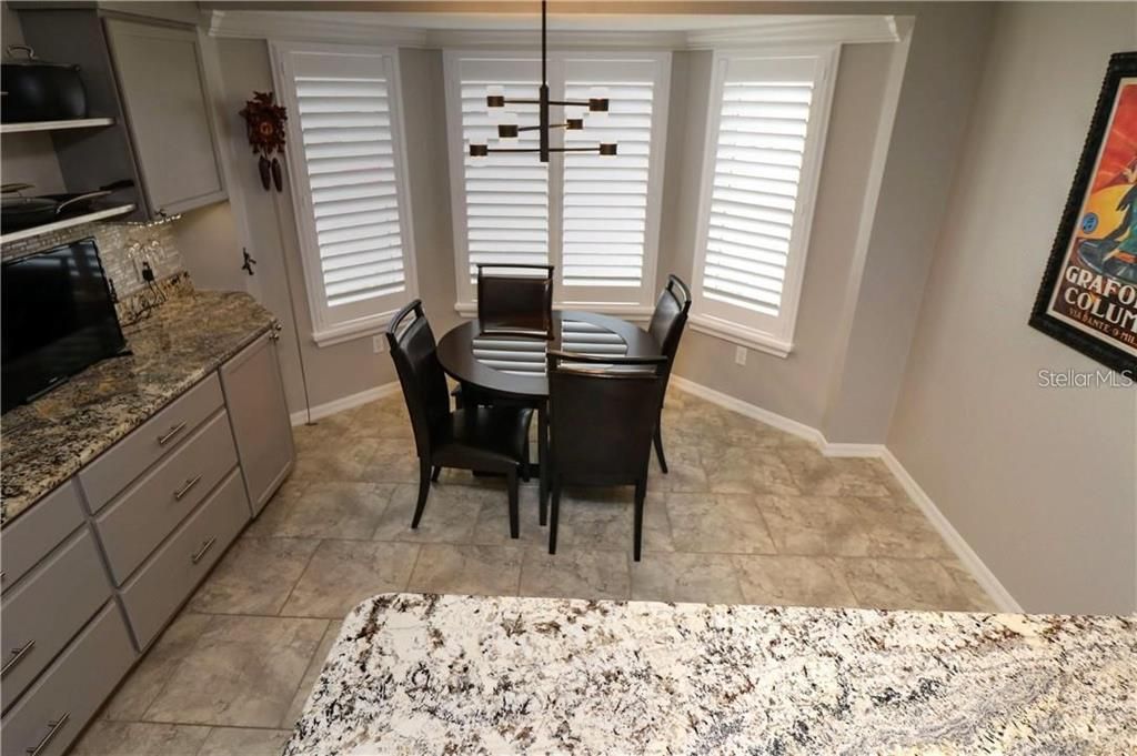 Eat in area of kitchen - Bay window with plantation shutters