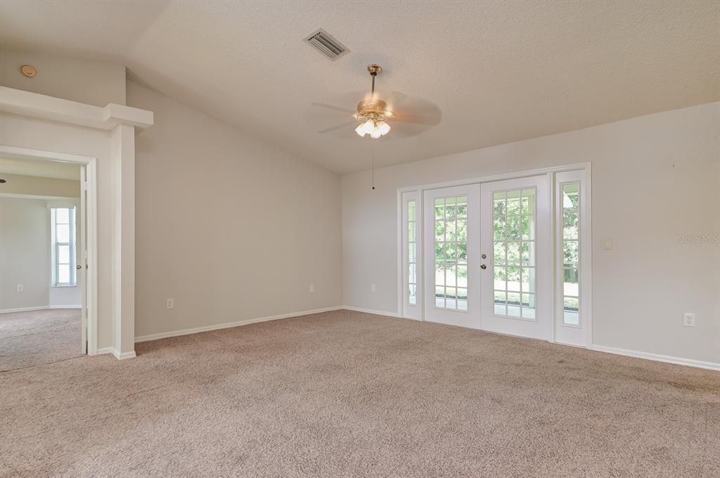 Great Room with door way leading to main bedroom with bath suite.