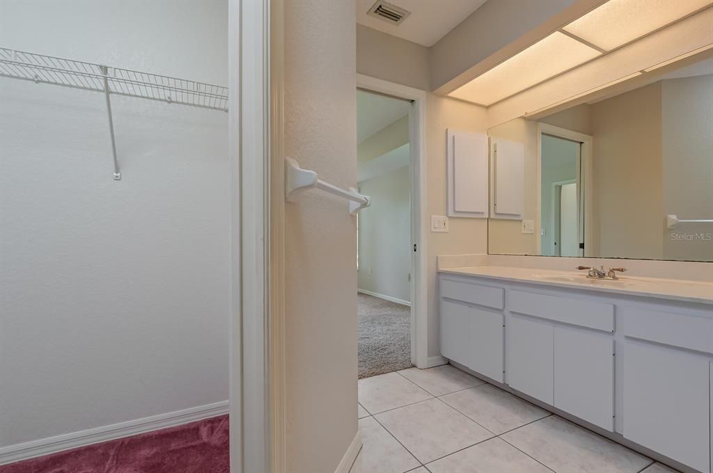 Main bedroom bathroom suite. Walk-in closet on left.