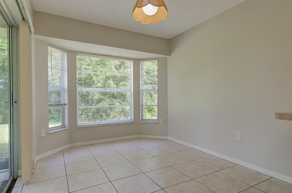 Kitchen has eat-in area/breakfast nook and sliders to Lanai.