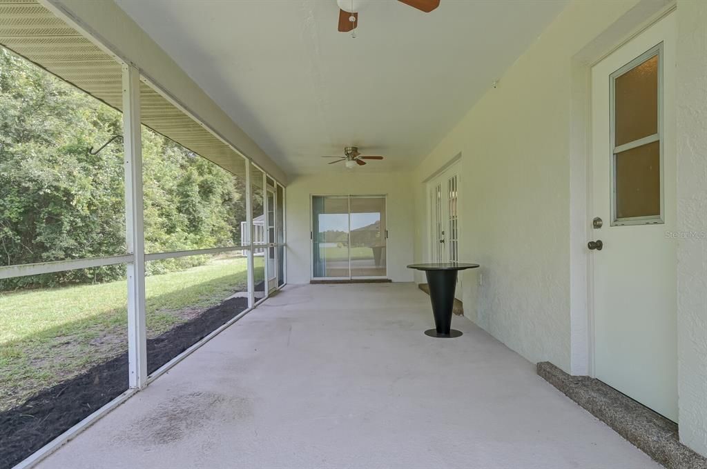 Screened Lanai has a screen door to access outside, sliders to Kitchen, french doors to Living room and bathroom access. Perfect to enjoy leisure time in Florida!