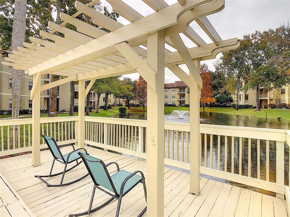 ENJOY YOUR MORNING COFFEE OR AFTERNOON BEVERAGE OUTSIDE OF THE COMMUNITY POOL OVERLOOKING THE POND & FOUNTAIN.