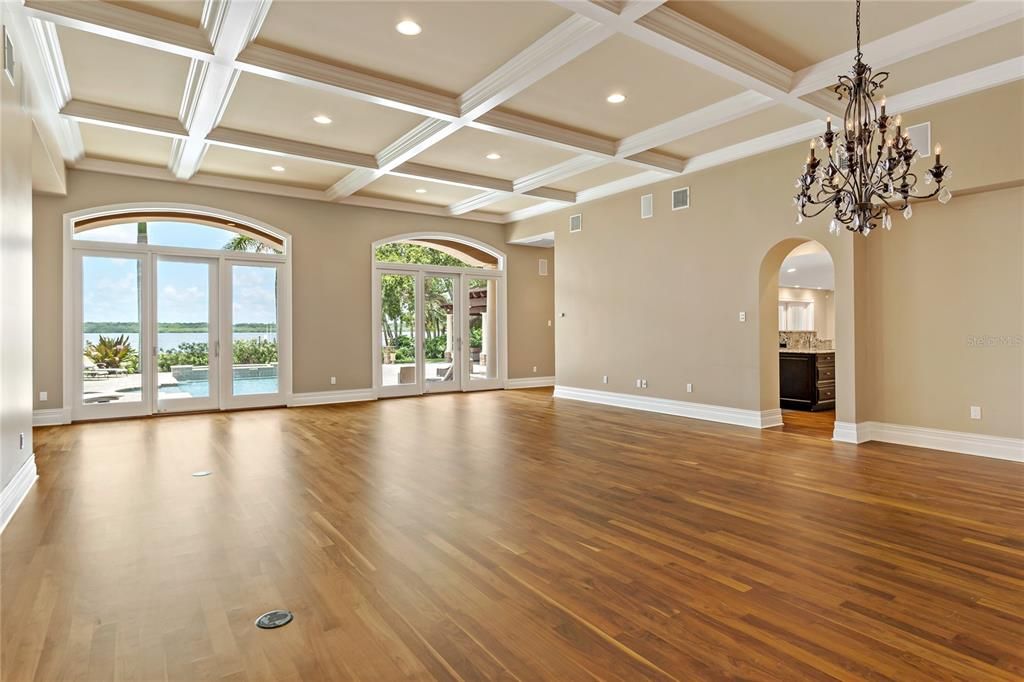 Exquisite formal living and dining areas with 12 foot coffered ceilings, level 5 flat texture finishes and gorgeous hardwood flooring.