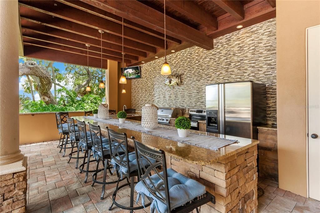 Outdoor entertaining has never been easier with this full catering kitchen including oven warming drawers, full refrigerator, grill and much more!