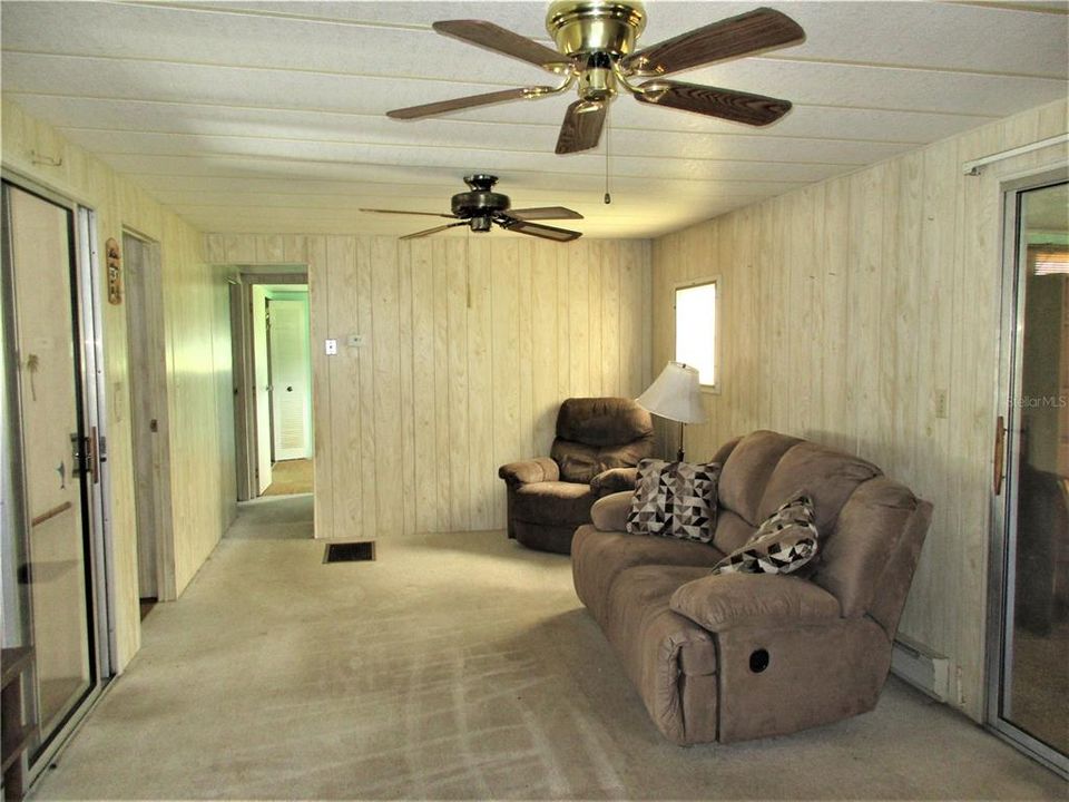 Main house living room. slider on left to garage - slider on right to porch