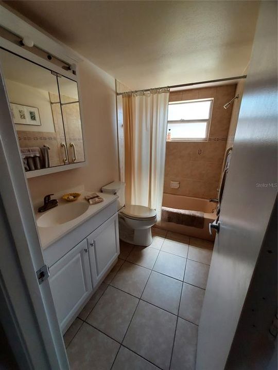 Hallway to guest bath and linen closet