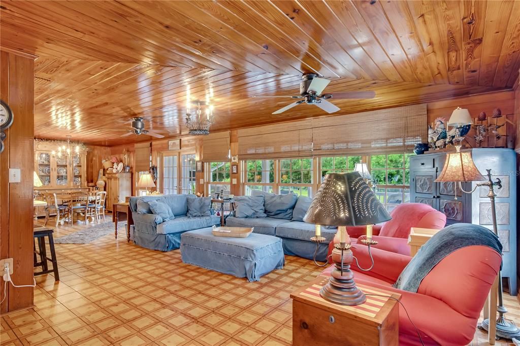Family room with original wood ceilings and walls