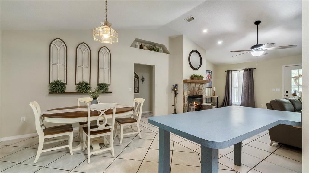 Kitchen overlooking dining room and partial fireplace view