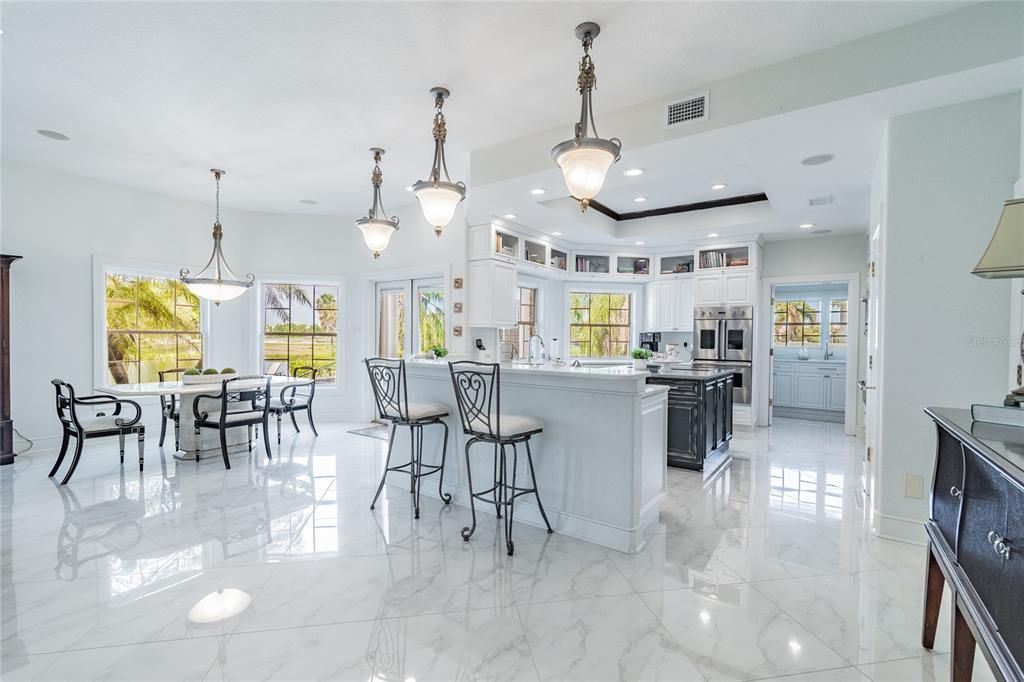 Marble Counters, Kitchen Island, Built-in cooking service and high end Viking appliances, and Walk-in Pantry.
