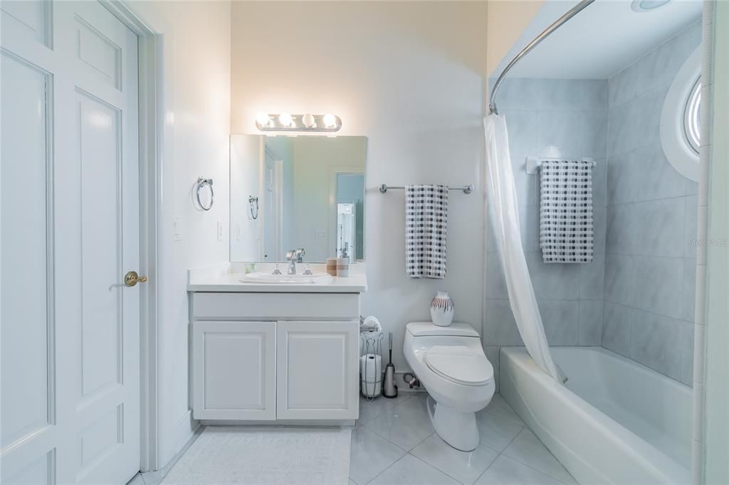 Single Vanity with a walk-in closet, tub w/shower.