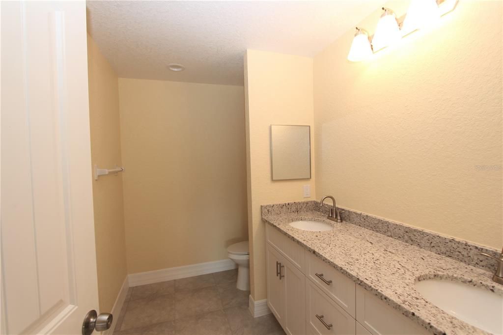 Master Bath has double sink vanity and large walk-in shower