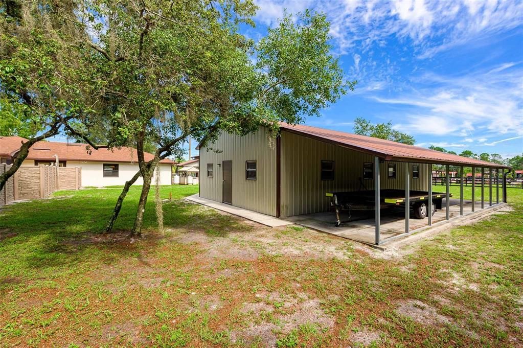 3rd outbuilding with 4 car garage and 12x44 Covered Parking/Storage area