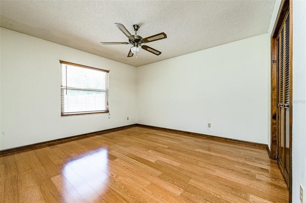 2nd bedroom with hardwood floors and walk-in closet and smaller closet for extra storage